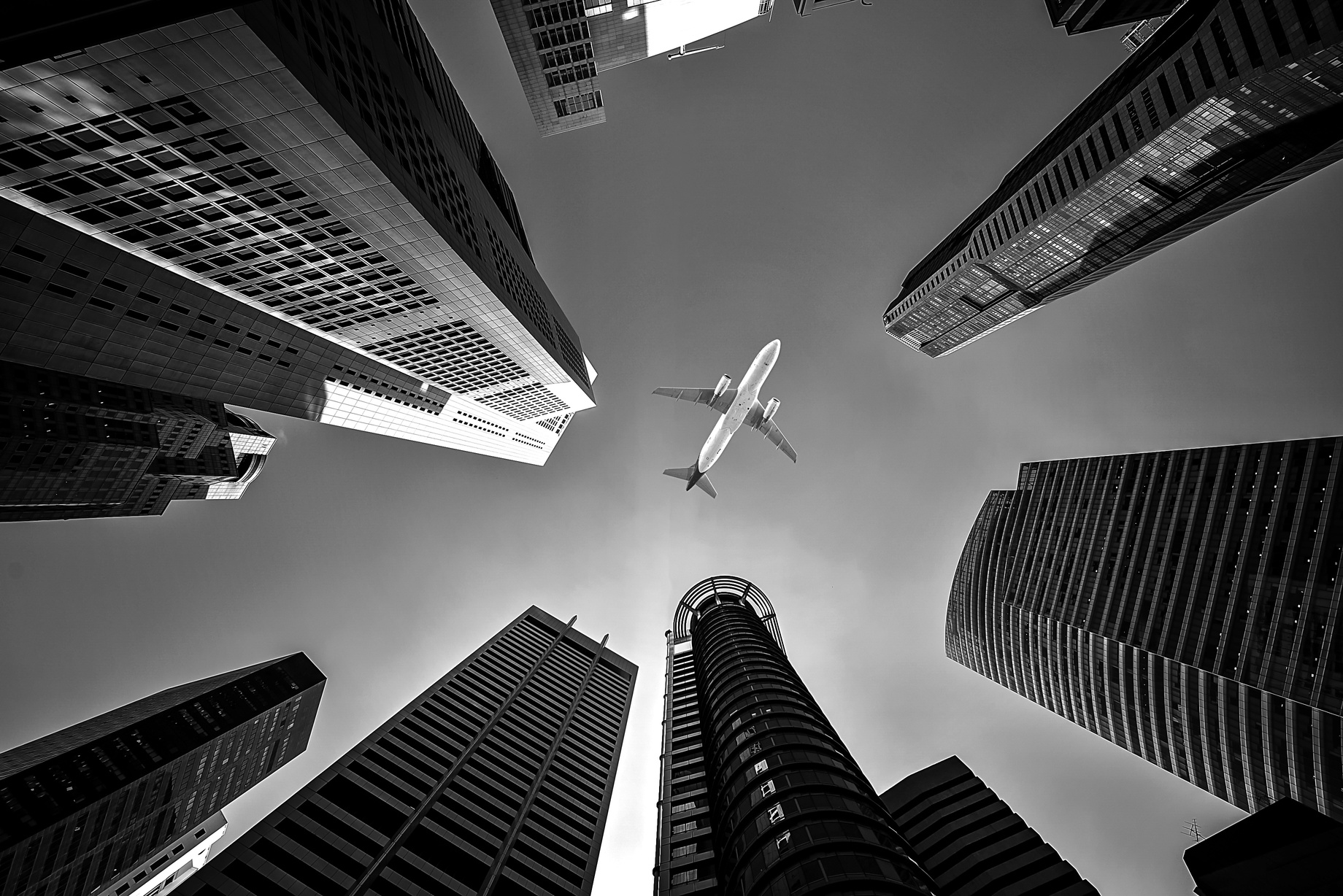 Worms Eye View of Skyscrapers and Airplane